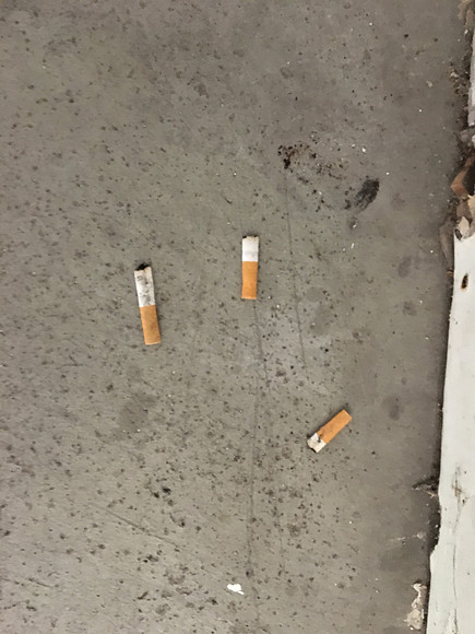 Cigarettes on parking spot.